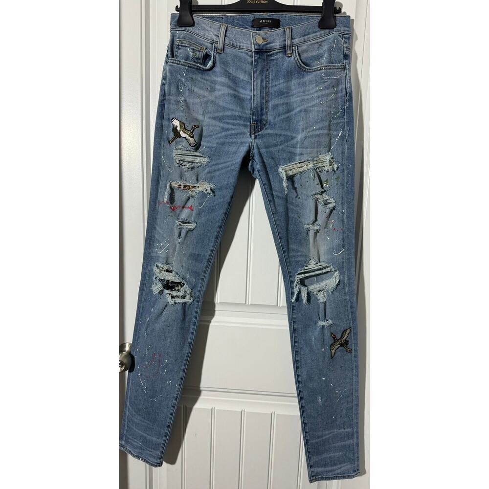 AMIRI Light Blue Distressed Skinny Jeans with Embroidered Patches
